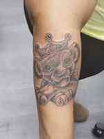 Red Octopus Tattoos & Body Piercings